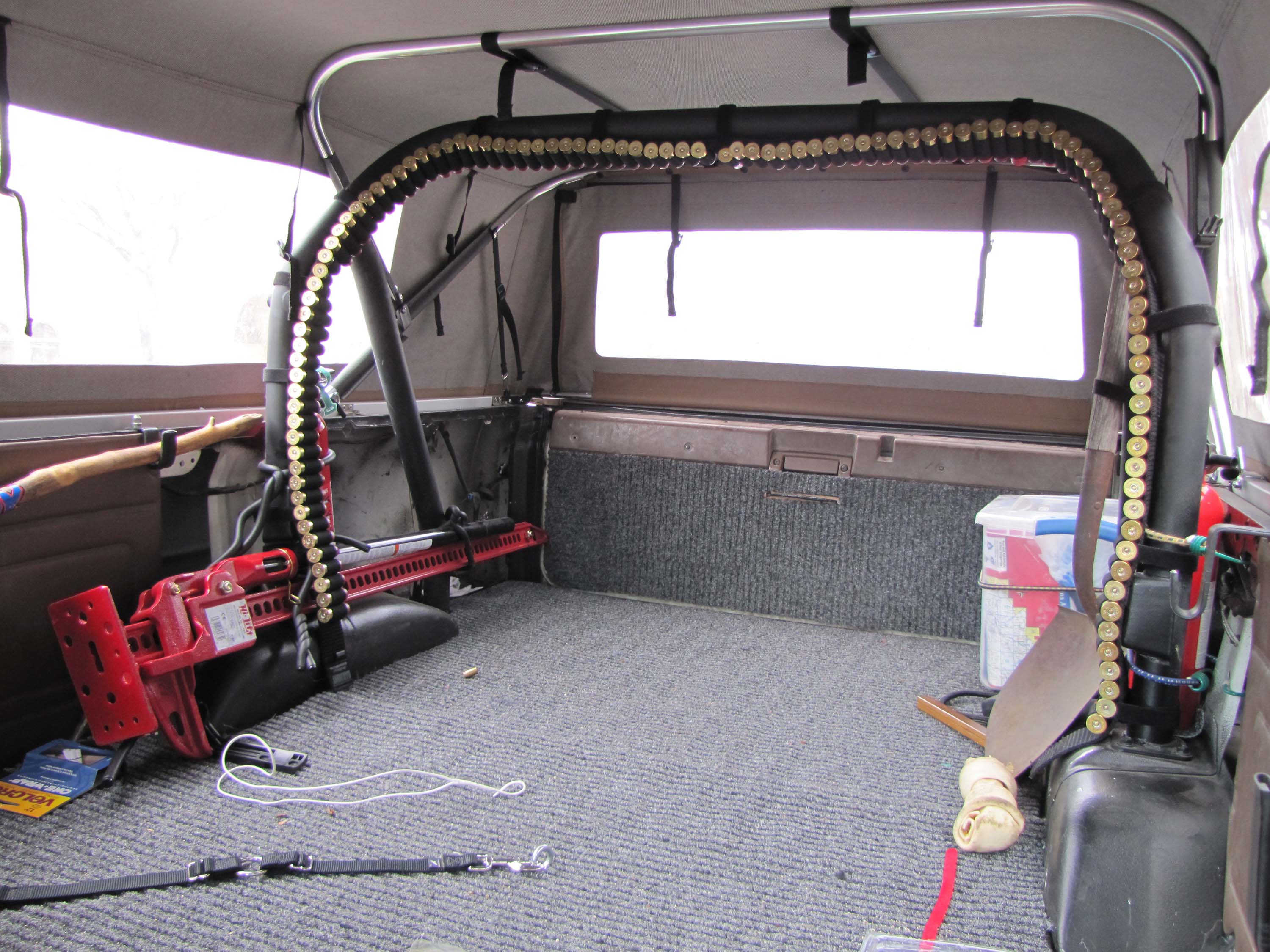 I used 2 Blackhawk bandoleers and strapped them to the roll bar in my 4runn...