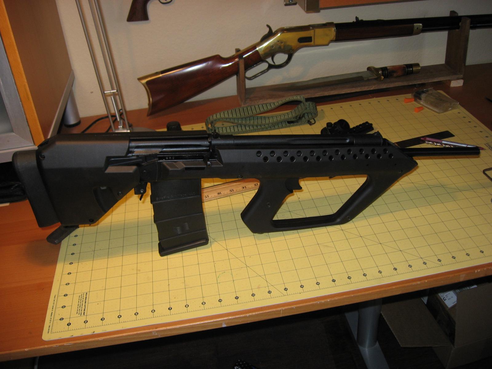 Here are a couple of pics of my 410 bullpup. 