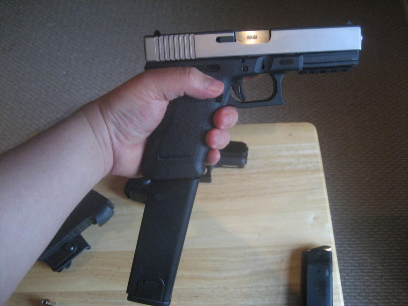 Either A Glock29 10mm Compact with a 17round hi cap..Or Glock 50gi conversi...